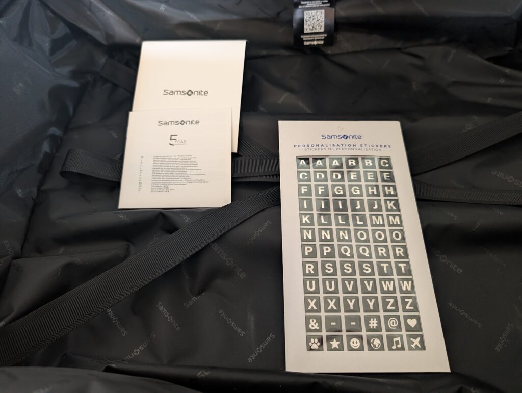 Samsonite Intuo Spinner L Koffer Garantiedokumente und Personalisierungsssticker