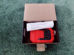 FUXTEC FX-E2LBS Laubsauger Ladegerät Verpackung offen