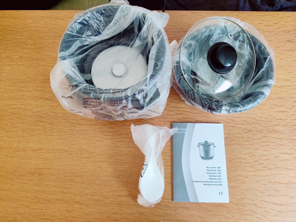 Emerio RCE-110118.5 Reiskocher in Plastik verpackt